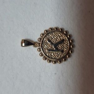 14 KT GOLD CHARM DAUGHTERS CHARM . LETTER K AND HEART ON ONE SIDE.